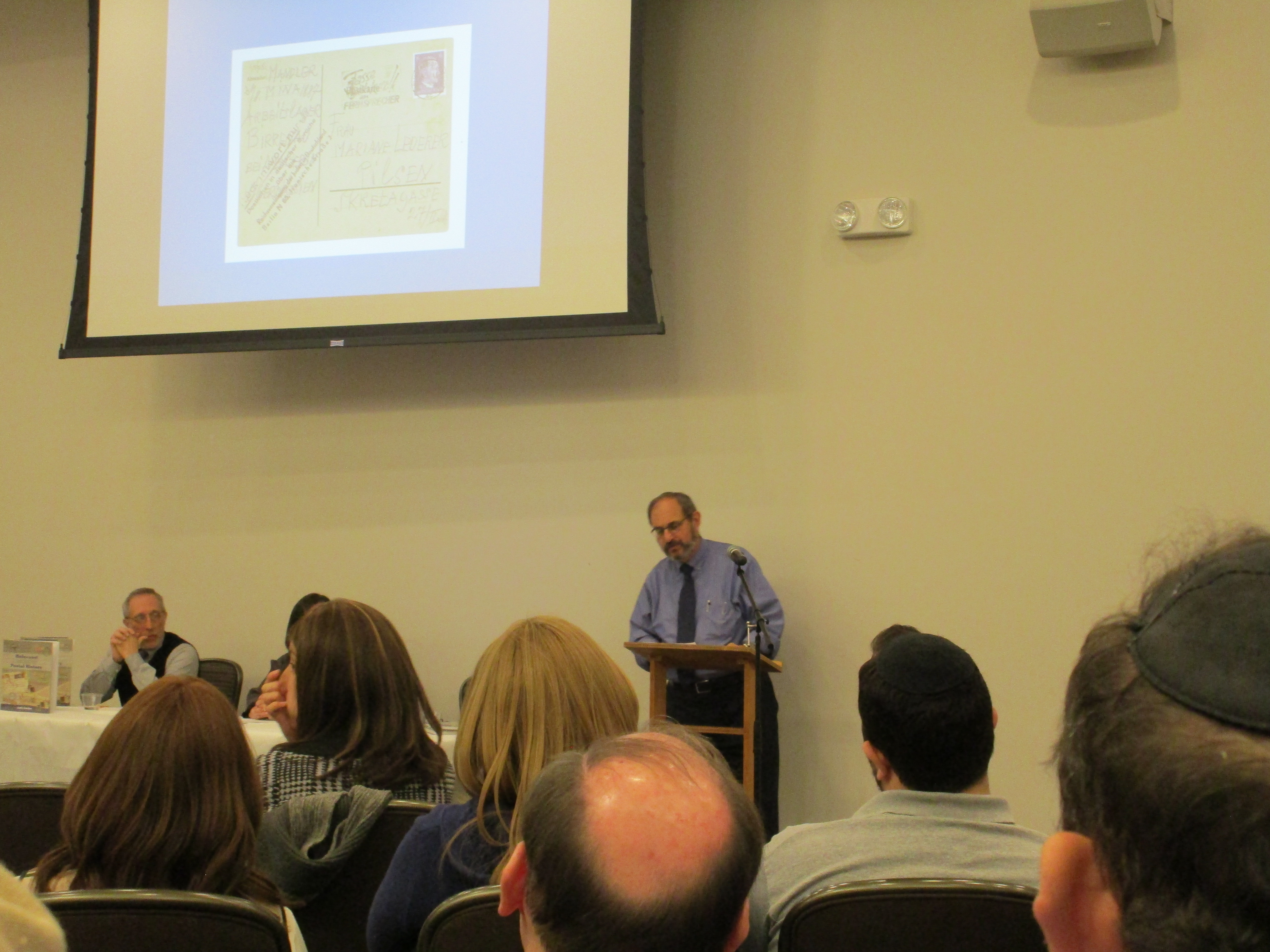 Author Justin Gordon address the audience, sharing his personal history and reasons for writing Holocaust Postal History. 